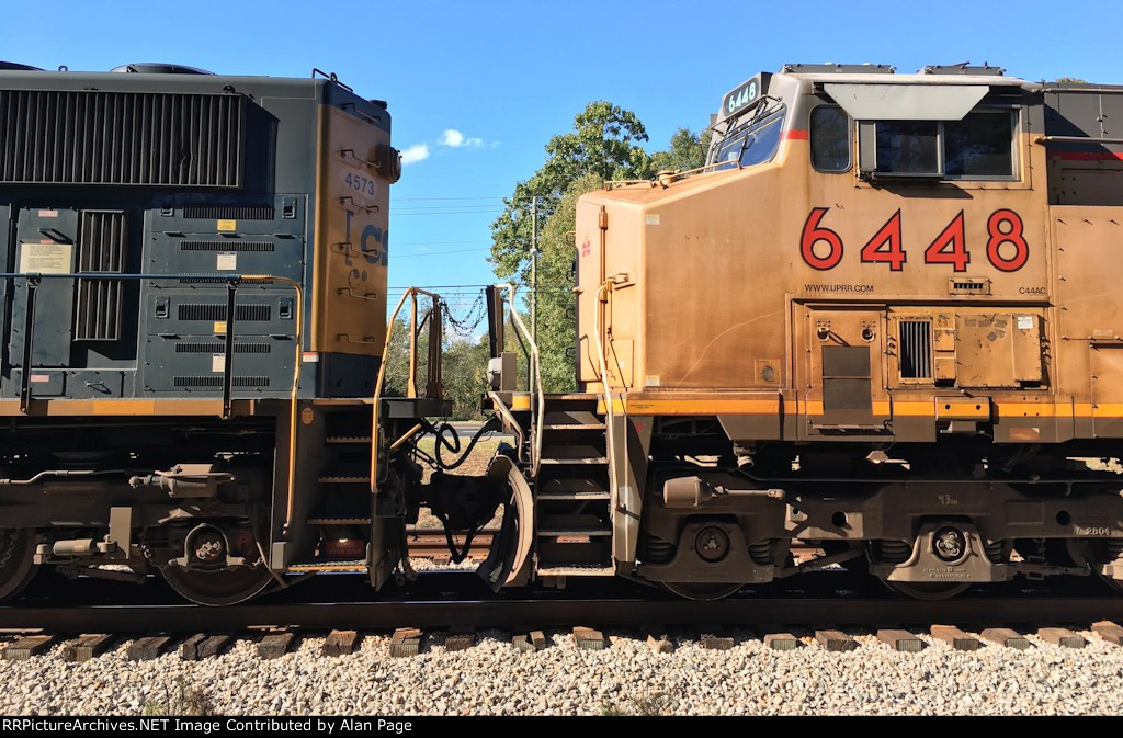 The nose of UP 6448 and tail of CSX 4573